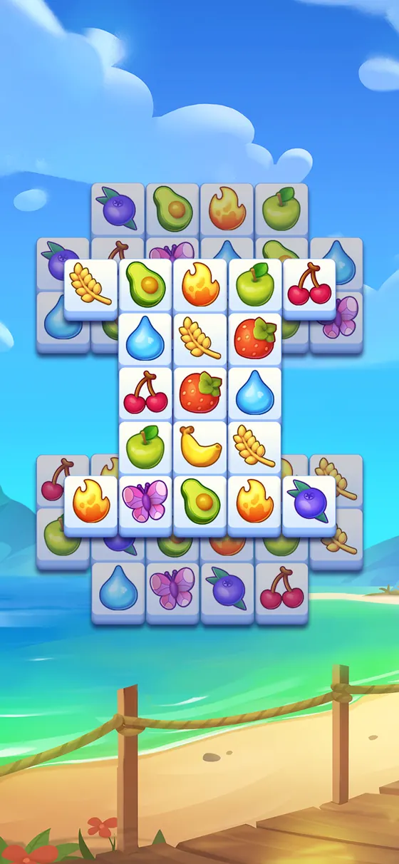 Triple Tile level with a tall stack of fruit tiles by the sea